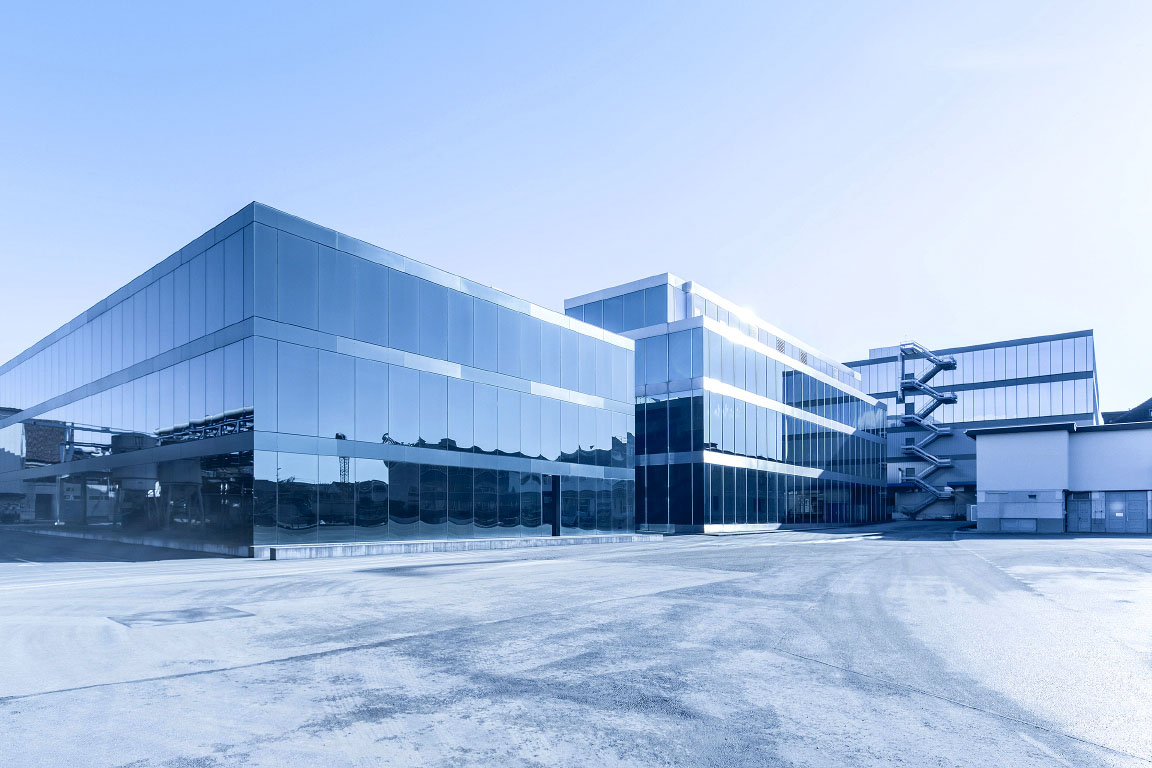 Building complex at the headquarters of Siegfried AG in Zofingen in monochrome light blue