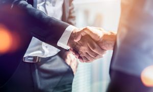 Close-up of two business people shaking hands
