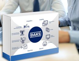 Photo of a white and blue box with a diagram on it consisting of the DAKS logo in the center and eight icons around it symbolizing various alarm sources and targets