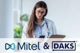 Nurse with cell phone and clipboard, with the Mitel logo and the DAKS logo below