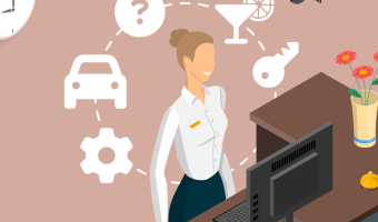 Hotel employee smiling at the reception desk