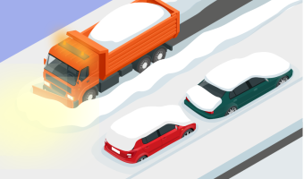 Snow removal vehicle clears snow from the road